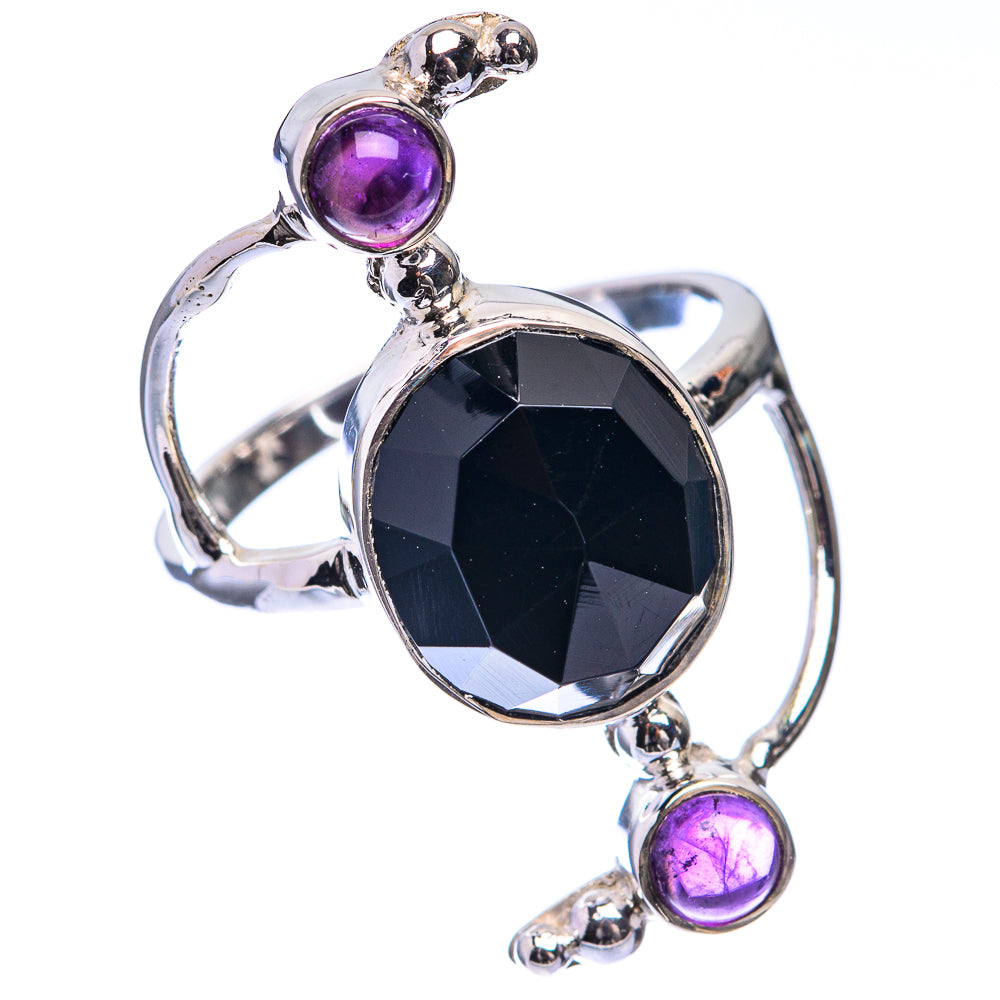 Sterling silver ring with black onyx center stone and three amethyst accents