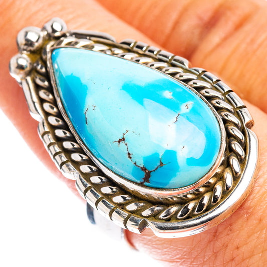 Adjustable sterling silver ring with turquoise teardrop cabochon and ornate bezel