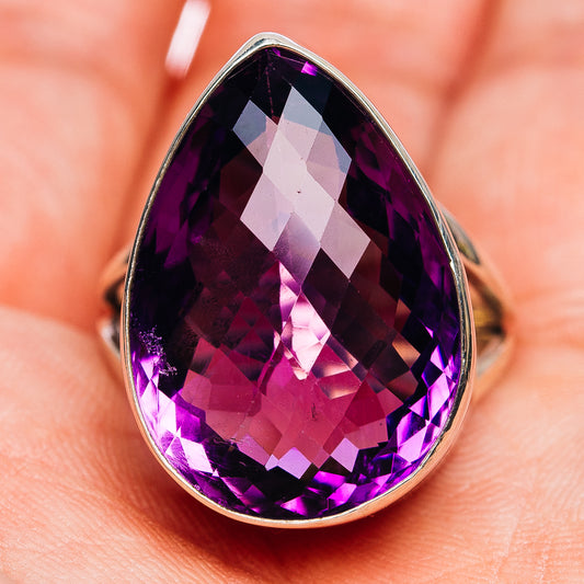 Faceted amethyst teardrop ring with .925 sterling silver setting, angled close-up