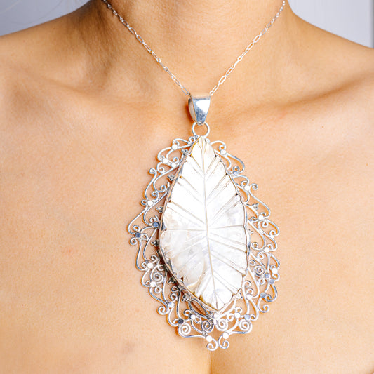 Sterling silver mother-of-pearl teardrop pendant with ornate filigree, on chain