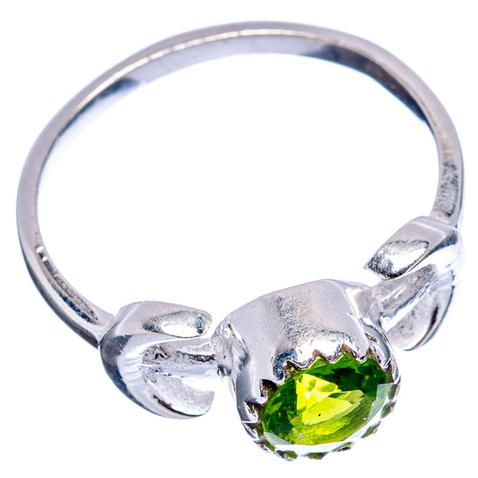 Sterling silver ring with round green peridot, three-prong setting and leaflike band details