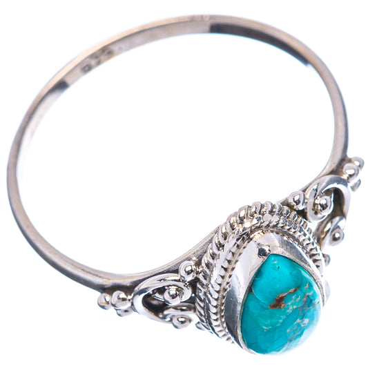 Turquoise cabochon sterling silver ring, detailed side prongs and textured setting