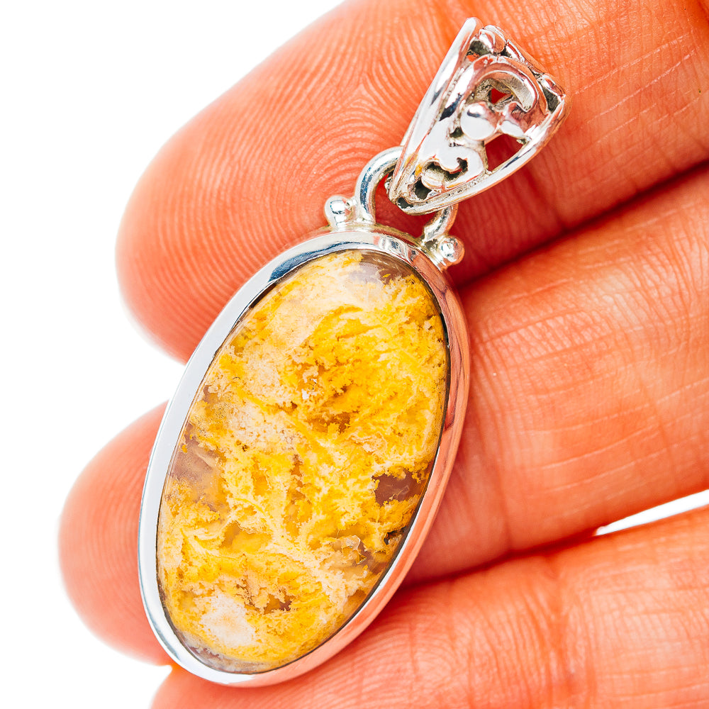 Sterling silver oval agate pendant with yellow stone in bezel setting