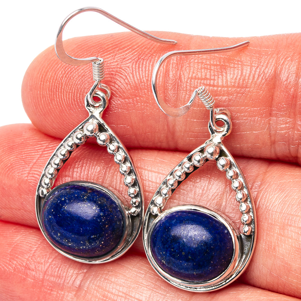 Lapis lazuli teardrop earrings in .925 sterling silver with textured border and hooks