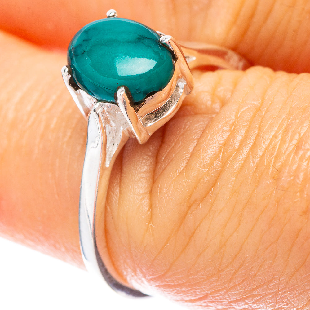 Sterling silver ring with oval turquoise cabochon, raised bezel setting