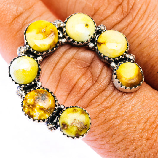 Naja-style sterling silver ring with six yellow oval stones in dark bezel settings