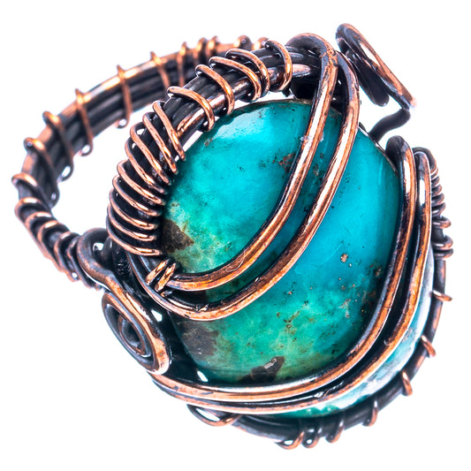 Turquoise gemstone wire wrap ring with oxidized copper oval frame