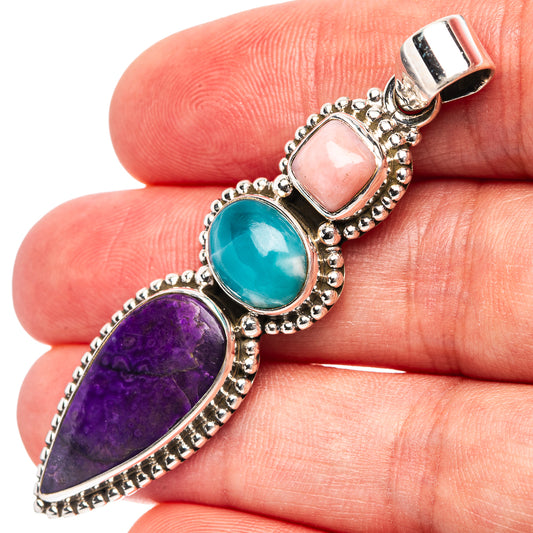 Sterling silver pendant with three oval stones in pink, teal, and purple and loop bail