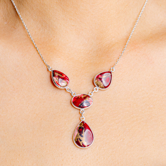 Sterling silver necklace with red teardrop pendants