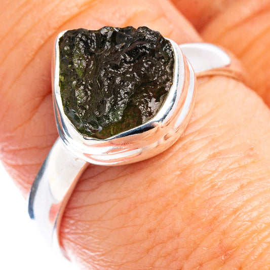 Sterling silver ring with irregular green moldavite stone, open setting