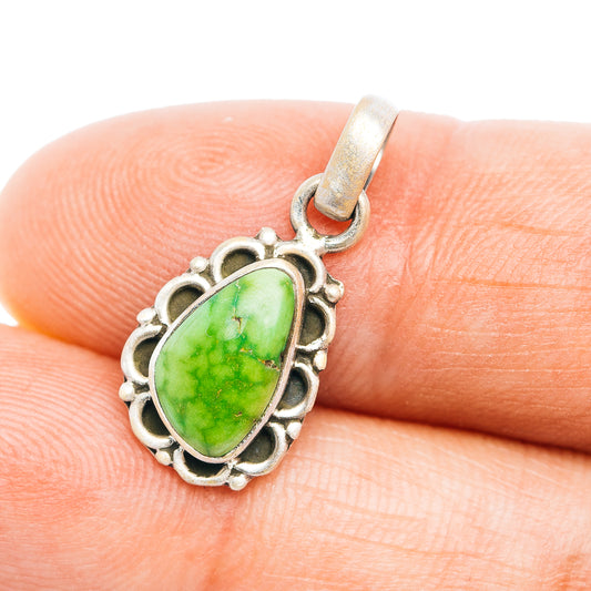 Sterling silver pendant with green turquoise teardrop stone and scalloped bezel