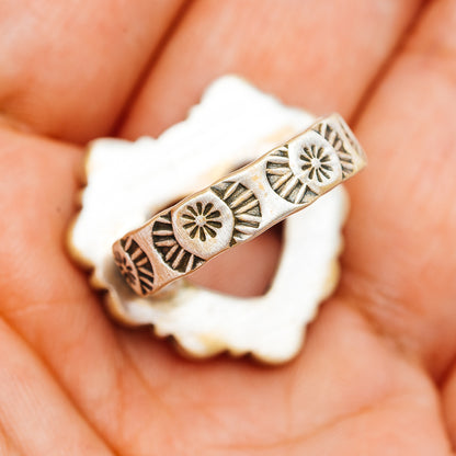 Sterling silver band with southwestern etched medallion and fan pattern