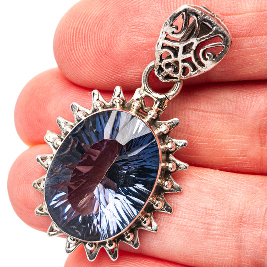 925 sterling silver pendant with round blue gemstone and ornate spiked bezel, hanging loop