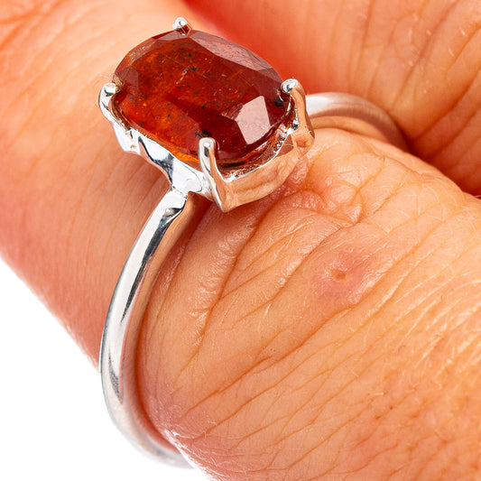 Sterling silver ring with orange kyanite teardrop stone, three-prong setting