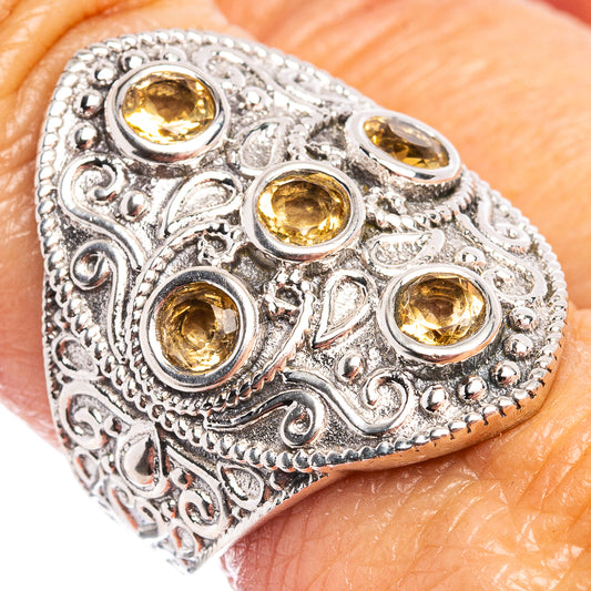 Sterling silver citrine ring with ornate filigree and four round yellow gemstone settings