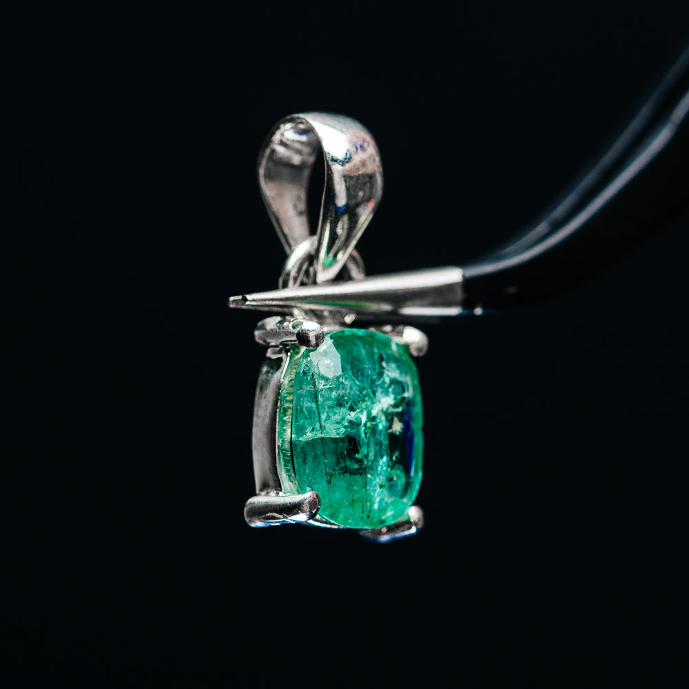 Sterling silver emerald pendant with green oval stone in prong setting
