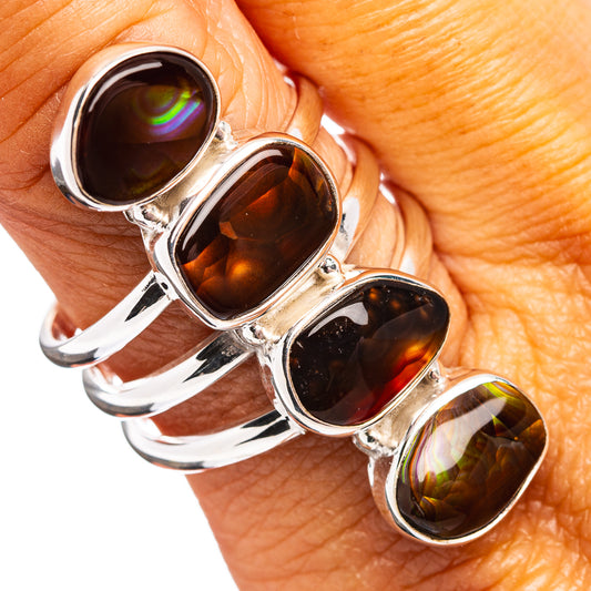 Oval dark amber opal cabochon ring with four stones in .925 sterling silver band
