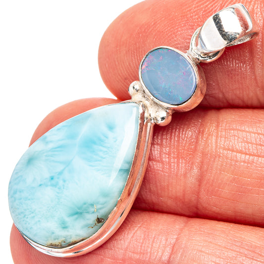 Sterling silver double-drop pendant with light blue opal and iridescent oval stone