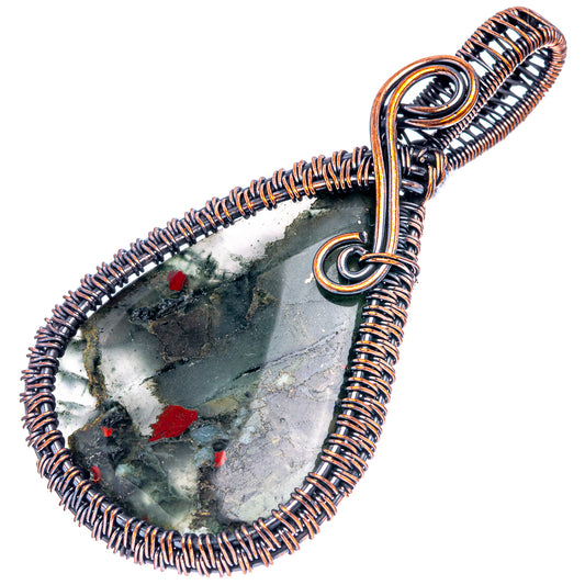 Oxidized copper wire-wrapped bloodstone teardrop pendant on spiral wire frame