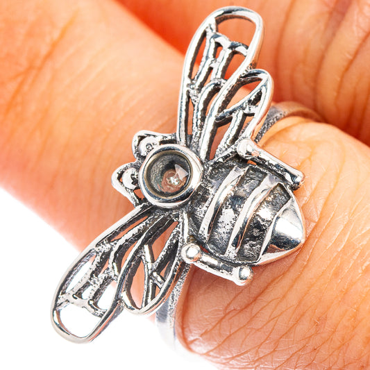 Sterling silver bee ring with round aquamarine stone and openwork detail