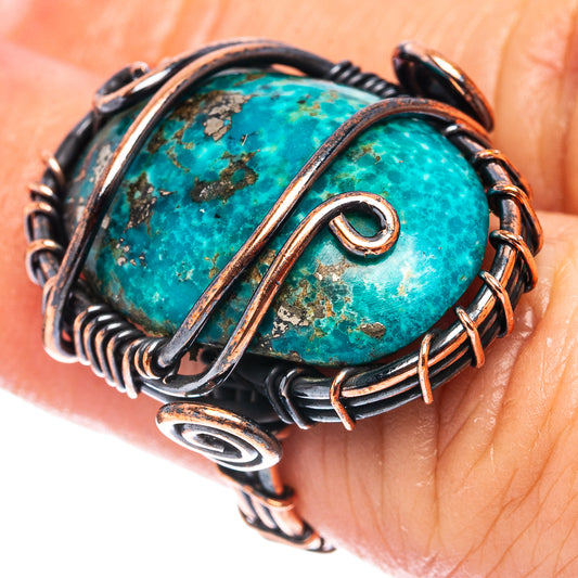 Turquoise oval cabochon wire-wrap ring with oxidized copper bezel and spirals