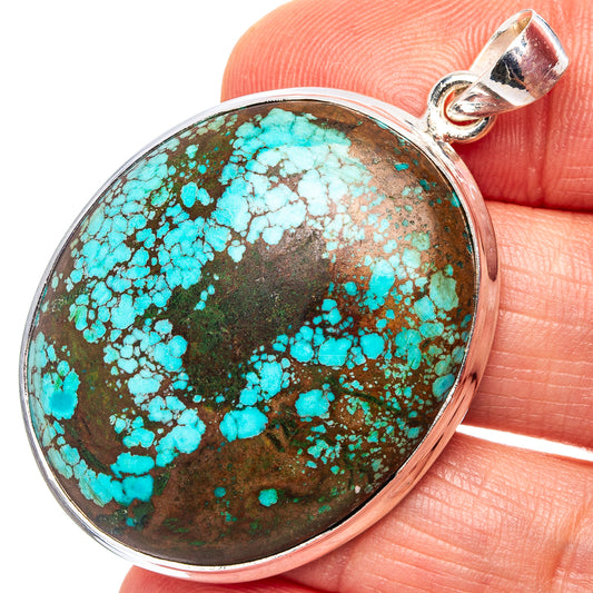 Oval turquoise pendant with brown matrix, .925 sterling silver frame and bail