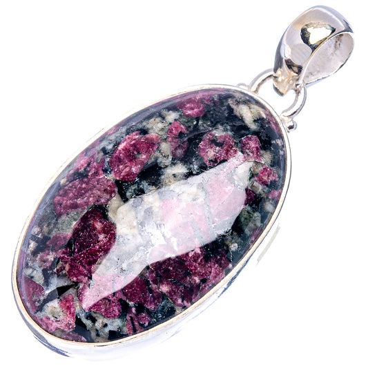 Oval eudialyte pendant in .925 sterling silver setting, faceted purple, black, and white tones