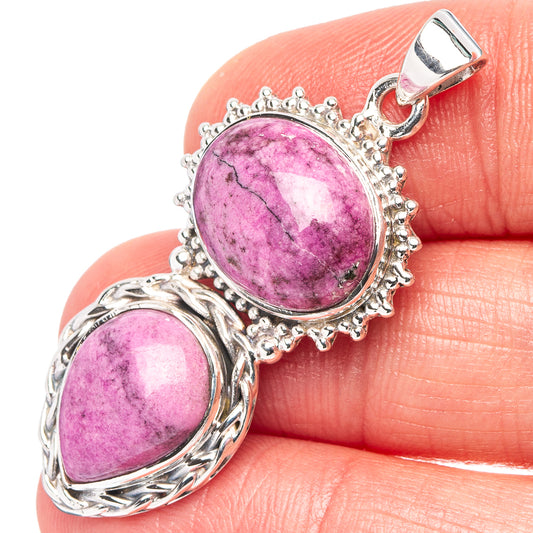 Oval purple calcite pendant in .925 sterling silver with ornate frame and clasp bail