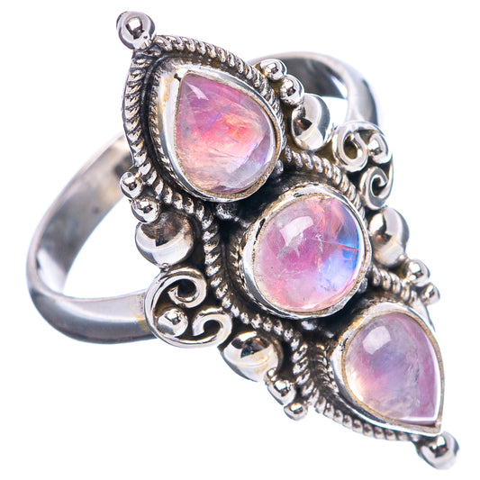 Sterling silver moonstone ring side view with three teardrop pink stones, split band