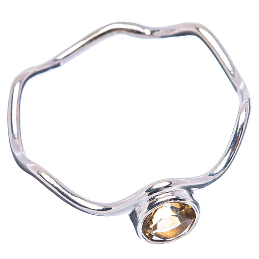 Sterling silver sculpted band with small round citrine gemstone accent