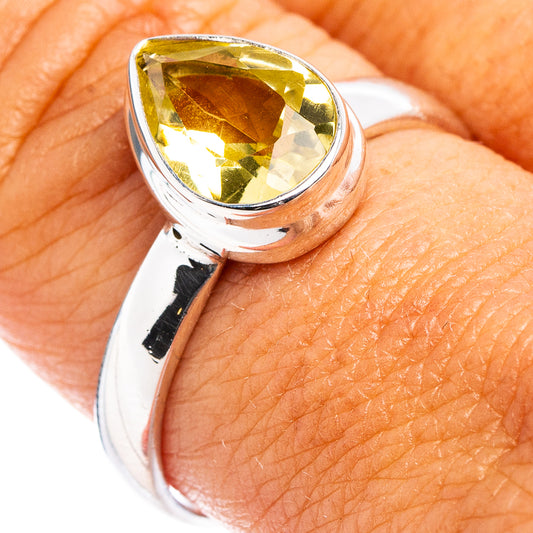 Faceted lemon quartz ring with silver band, yellow gemstone set in a teardrop bezel