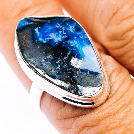 Sterling silver opal ring with oval blue-and-black boulder opal cabochon