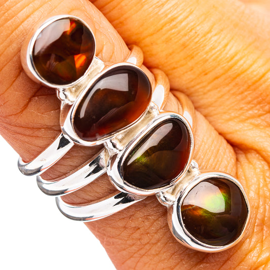 Sterling silver ring, size 7.75, with four oval fire opal cabochons in dark red.