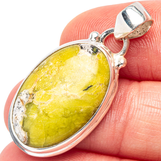Oval lizardite pendant with yellow-green stone in .925 sterling silver bezel and bail
