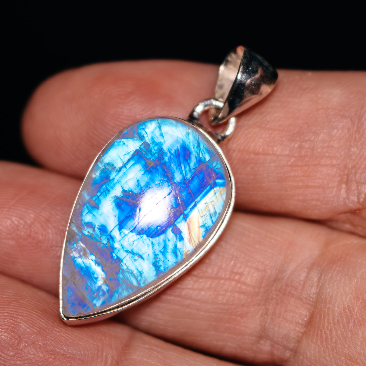 Teardrop moonstone pendant in .925 sterling silver with vivid blue rainbow shimmer