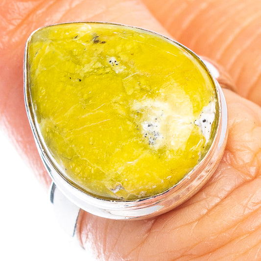 Sterling silver ring with yellow lizardite oval cabochon, close-up view