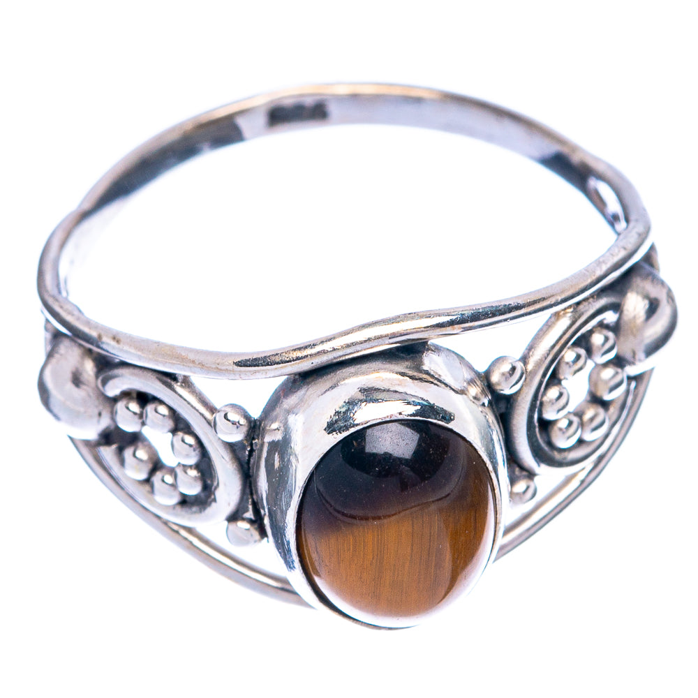 Sterling silver ring with oval tiger eye cabochon and engraved side filigree, size 7