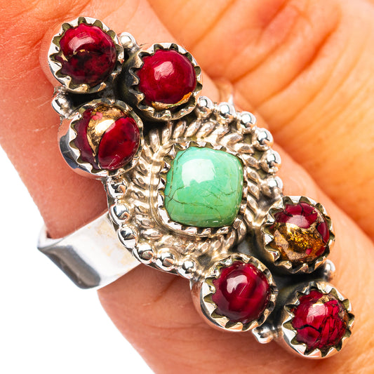 Sterling silver adjustable ring with red bezel stones and green turquoise center stone