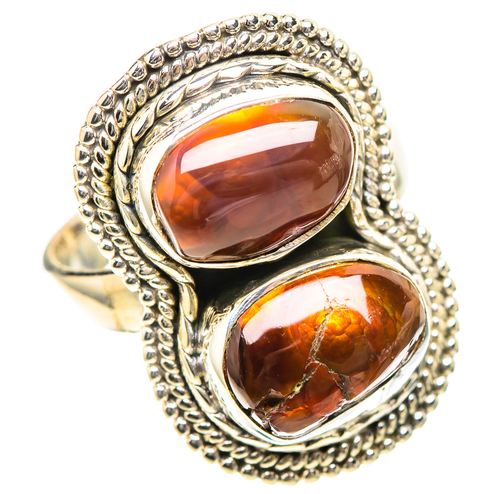 Sterling silver ring featuring two oval-teardrop orange cabochons in rope-style settings