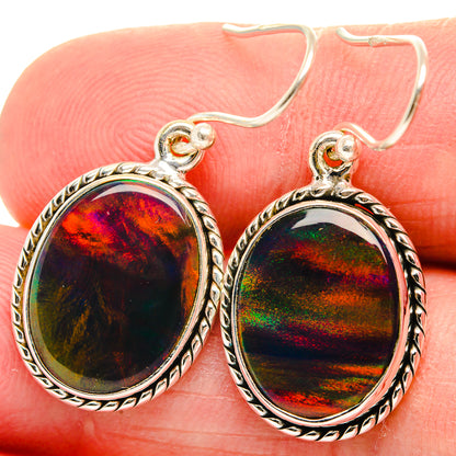 Sterling silver oval opal hook earrings with iridescent red-green stone