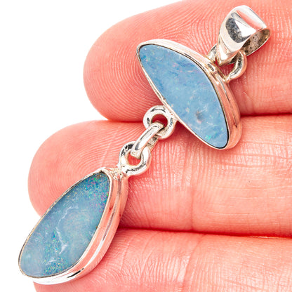 Sterling silver doublet opal pendant with two oval blue opal stones on chain links