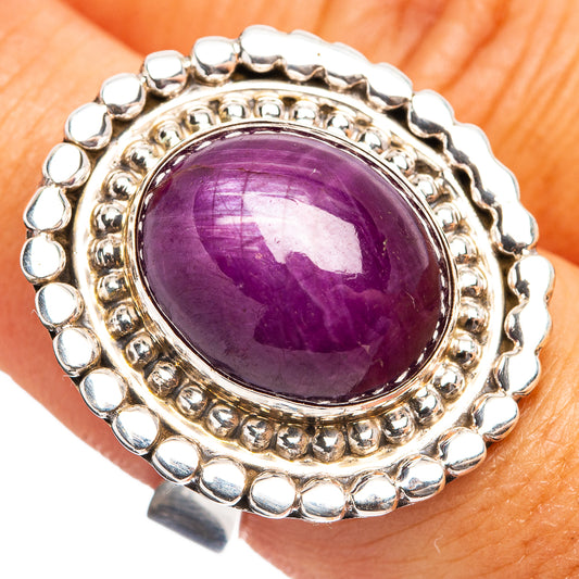 Sterling silver oval purple gemstone ring with round beaded halo setting