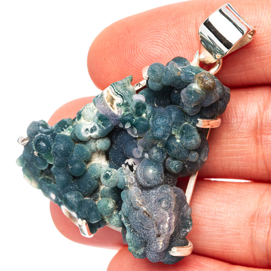 Grape agate pendant with dark teal blue druzy cluster and silver bail, close-up