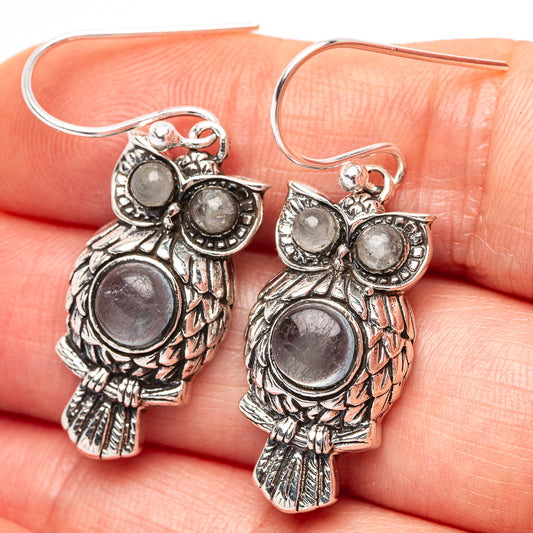 Sterling silver owl drop earrings with aquamarine blue round stones