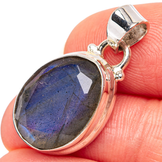 Oval faceted labradorite pendant with sterling silver setting, blue-gray flash and bail