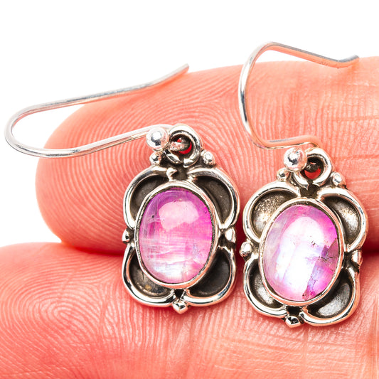 Sterling silver drop earrings with oval pink moonstone cabochons and ornate floral frames