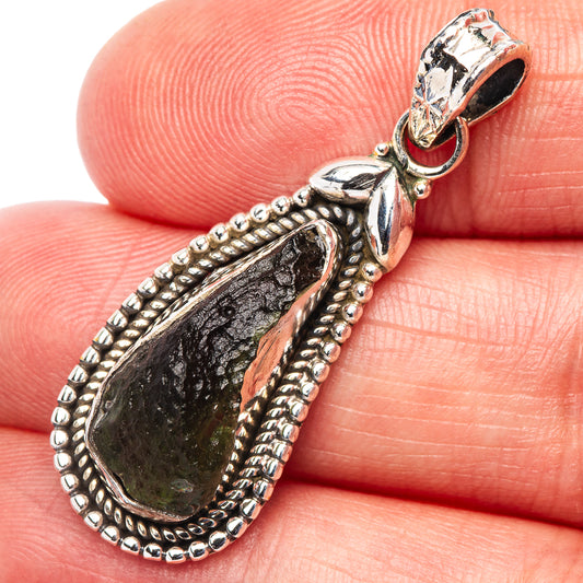 Moldavite pendant close-up: .925 sterling silver bail and dark green teardrop stone