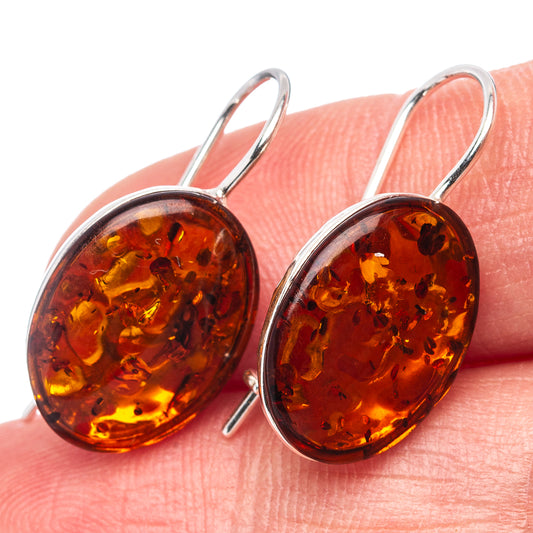 Oval amber drop earrings in .925 sterling silver with warm honey orange stones