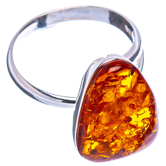 Silver adjustable ring with amber teardrop centerpiece and polished facets