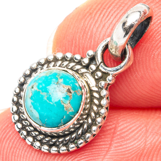 Turquoise stone pendant in ornate .925 sterling silver setting with loop bail